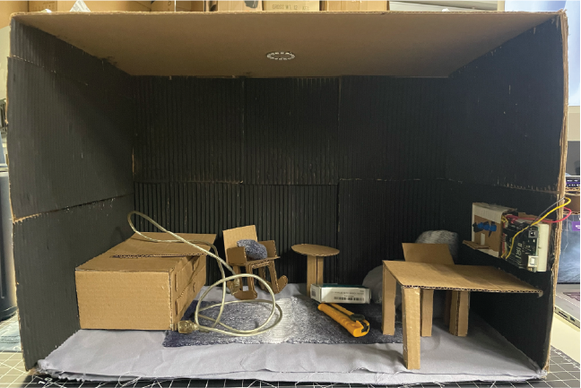 This image shows the inside of the box with all the different sensory experiences as well as the control panel for the Touch Designer graphics and the light.